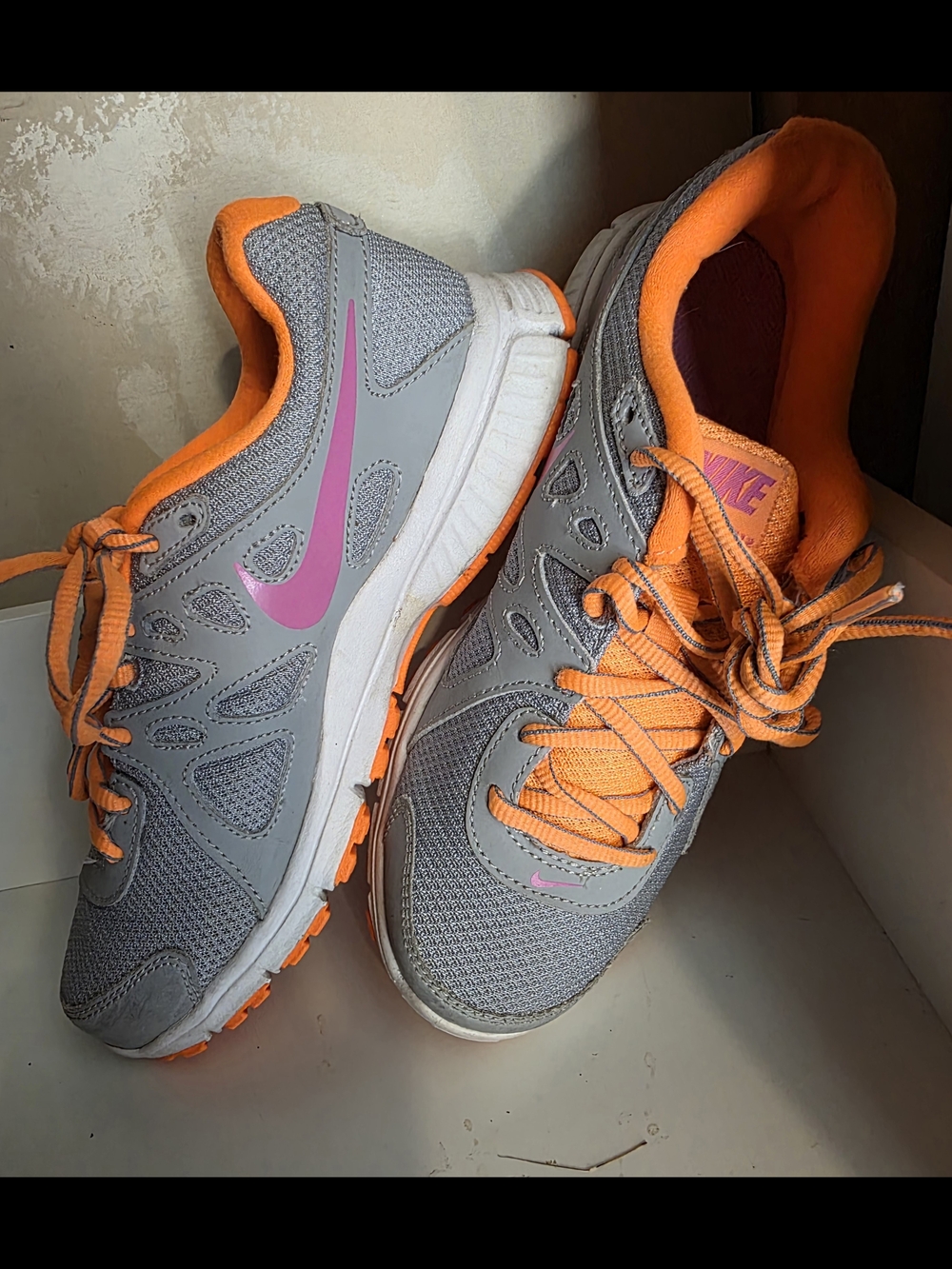 Nike Gray Athletic Sneakers with Bright Orange Laces and Pink Swoosh